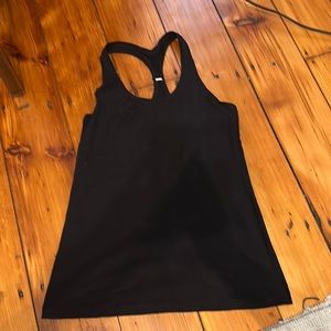 Lululemon workout top. Size medium. Lightly worn. Tight fit.